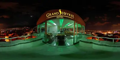 a grand hyatt hotel at night with a view of the city at Grand Heykel Hotel in Bursa