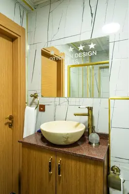 a bathroom with a large bowl sink on a counter at The Ottoman Desing Suit in Istanbul
