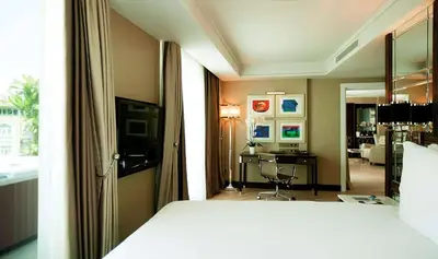 a bedroom with a bed and a room with a desk at Radisson Blu Hotel Istanbul Pera in Istanbul
