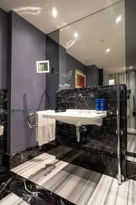 a bathroom with a sink and a mirror at Radisson Blu Hotel Istanbul Pera in Istanbul