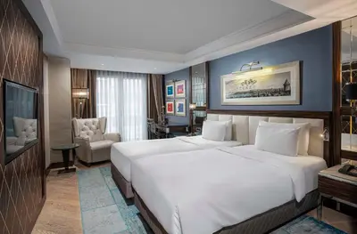 a bedroom with a large white bed in a room at Radisson Blu Hotel Istanbul Pera in Istanbul