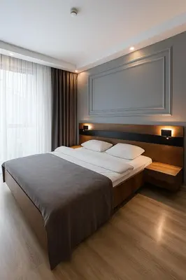 a bedroom with a large bed and a large window at On4 Rooms & Suites in Istanbul