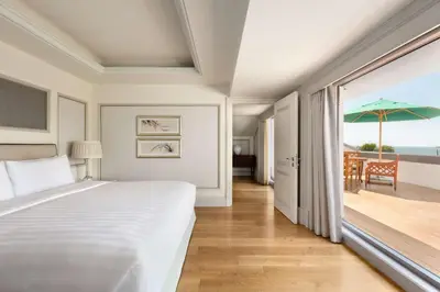 a bedroom with a bed and a view of the ocean at Shangri-La Bosphorus, Istanbul in Istanbul