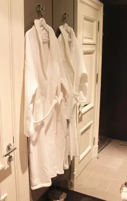 a group of white towels hanging on a door at Frida Suites in Istanbul