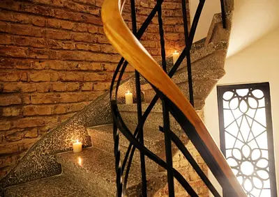 a staircase with candles and a brick wall at Frida Suites in Istanbul