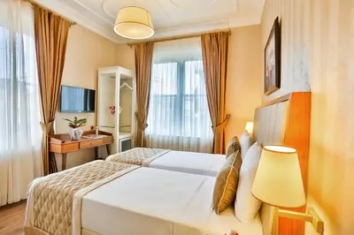 a hotel room with a bed and a desk at HANENDE HOTEL in Istanbul