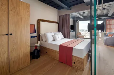 a bedroom with a bed and a large window at Stay Lab Residence in Istanbul