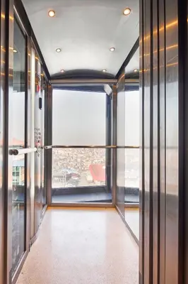 a hallway with glass doors and a large window at Stay Lab Residence in Istanbul