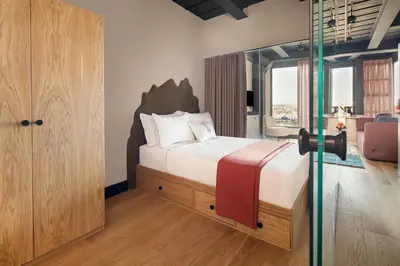 a bedroom with a bed and a glass door at Stay Lab Residence in Istanbul