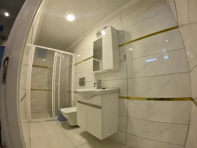 a white bathroom with a sink and a toilet at PASHA APART~BOUTİQUE HOTEL/YALOVA in Yalova