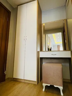 a bathroom with a vanity with a mirror and a stool at Zem Hotel in Istanbul