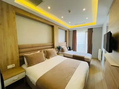 a hotel room with a large bed and a television at Zem Hotel in Istanbul