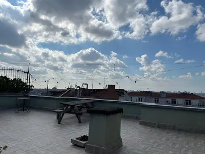 a picnic table on the roof of a building at Ganbaru Tours - Flats in Galata in Istanbul