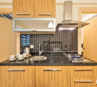 a kitchen with a sink and a stove at Invictum Residence in Istanbul