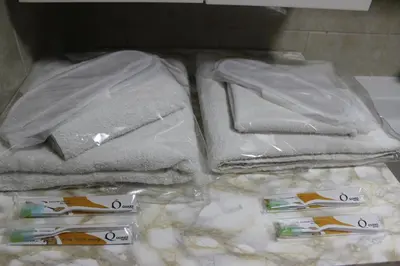 a drawer with towels and toothbrushes on a counter at Quars Suite in Esenyurt