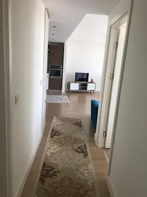 a hallway with a living room with a rug at Have a nice holiday in Istanbul