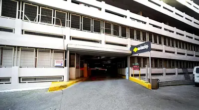 a large building with a parking lot in front of it at Meroddi Galata Flats in Istanbul