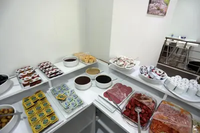 a buffet with many different types of food on a table at BEKSİTİ HOTEL in Yalova