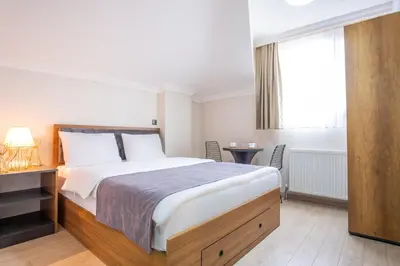 a bedroom with a large bed and a window at Campus Boutique Hotel in Istanbul