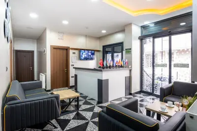 a waiting room with chairs and a bar at Campus Boutique Hotel in Istanbul