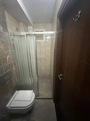 a bathroom with a shower and a toilet at Campus Boutique Hotel in Istanbul