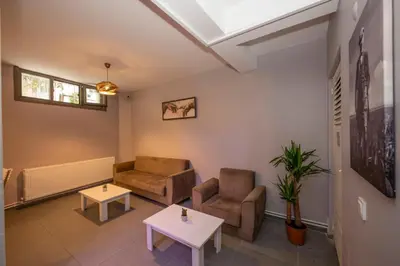 a living room with two chairs and a table at Taksim Square Hostel in Istanbul