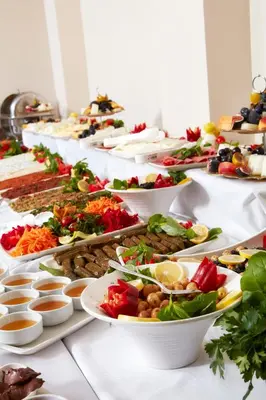 a buffet line of plates of food on a table at Almadina Hotel Istanbul in Istanbul