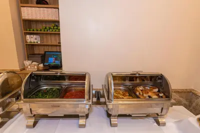 two trays of food sitting on top of a table at Almadina Hotel Istanbul in Istanbul