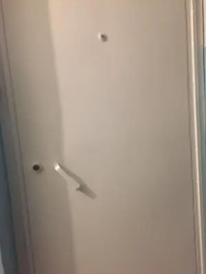 a white door with a handle in a room at Eda's Apartment in Istanbul