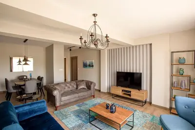 a living room with a couch and a tv at DM Suites Bosphorus in Istanbul