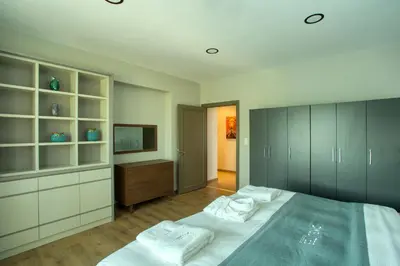 a bedroom with a large bed and a television at DM Suites Bosphorus in Istanbul
