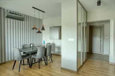 a dining room with a black table and chairs at DM Suites Bosphorus in Istanbul