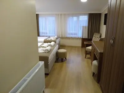a hotel room with a bed and a desk at Ribad Hotel Sultanahmet in Istanbul
