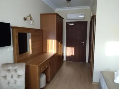 a room with a wooden desk and a chair at Ribad Hotel Sultanahmet in Istanbul