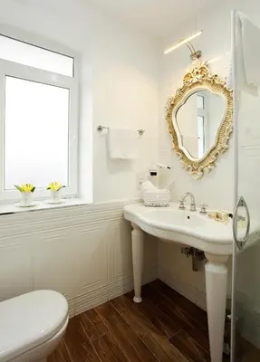 a white bathroom with a sink and a mirror at The White Swan Suites Beyoglu in Istanbul