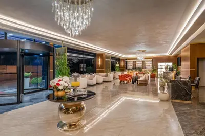 a lobby of a hotel with a chandelier at Best Western Premier Hidden Hills Hotel in Istanbul
