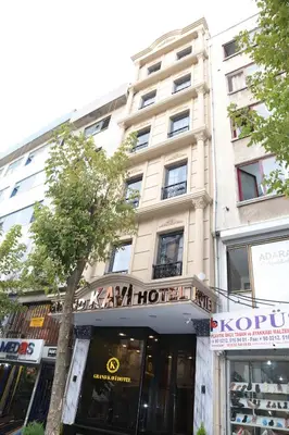 a building with a sign on the front of it at Grand Kavi Hotel in Istanbul