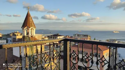 a view from a balcony of a building with a church at Grand Kavi Hotel in Istanbul