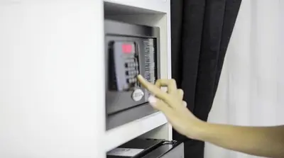 a person is pointing at a microwave oven at Cnr İnci Hotel in Istanbul