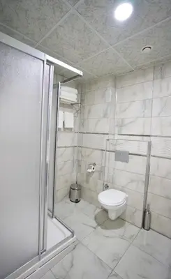 a bathroom with a shower and a toilet in it at Cnr İnci Hotel in Istanbul