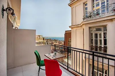 a balcony with a table and two chairs at West Palace in Istanbul