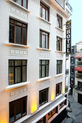 a white building with a sign on the side of it at West Palace in Istanbul