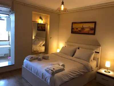 a bedroom with a bed with two stuffed animals on it at Sunshine Taksim Suite in Istanbul