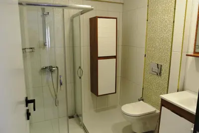 a bathroom with a shower and a toilet at Emirhan Guesthouse & Suites in Istanbul