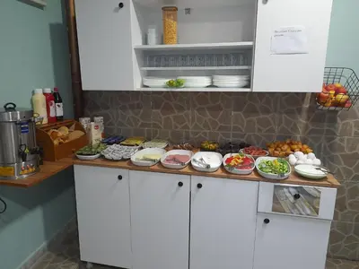 a kitchen with plates of food on a counter at Emirhan Guesthouse & Suites in Istanbul