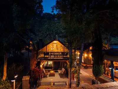 an aerial view of a house at night at antik river house in Sile