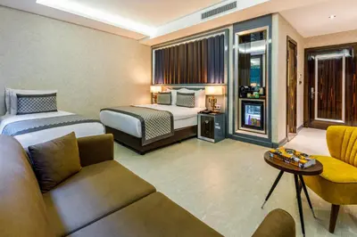 a hotel room with a bed and a couch at Euro Design Hotel in Istanbul