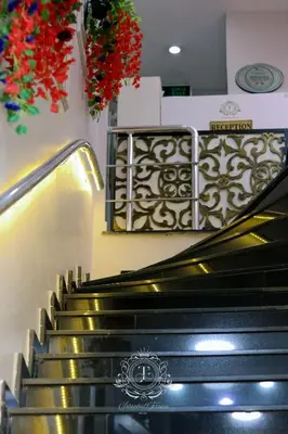 a set of stairs in a building with flowers at İstanbul Terrace Hotel in Istanbul