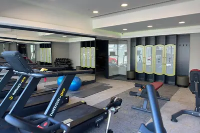a gym with treadmills and exercise equipment in a room at Tryp by Wyndham Istanbul Topkapi in Istanbul