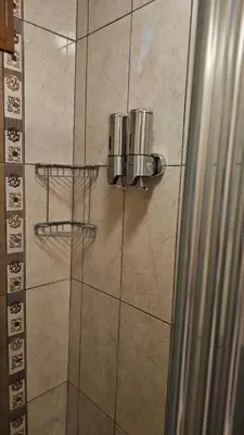 a shower with a glass door in a bathroom at The Pashas House in Istanbul
